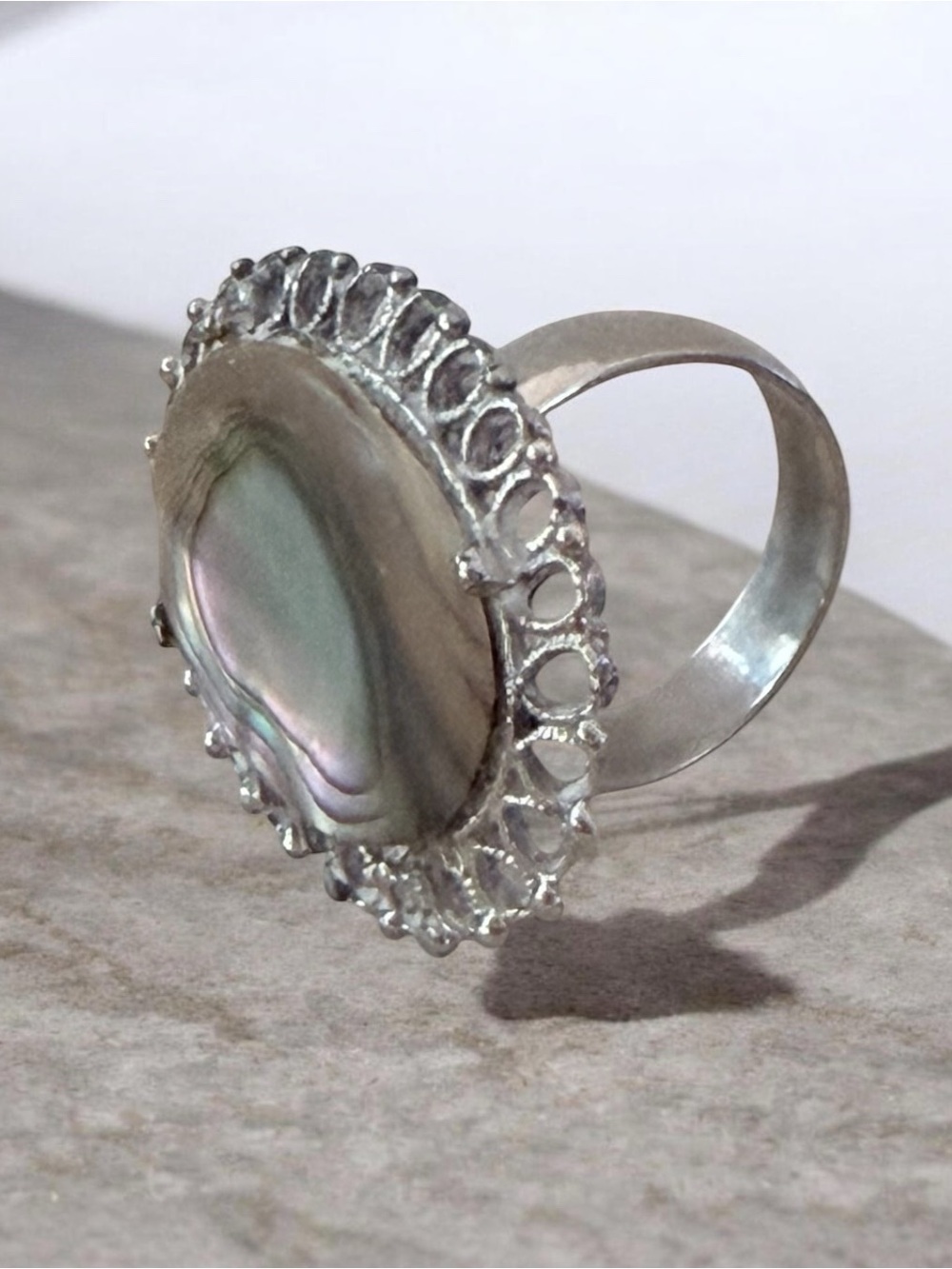 vintage silver statement ring featuring an oval abalone or paua shell